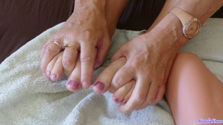 Natalie K begins with playful feet attention before turning it into a relaxed, explicit footjob sequence. image 2