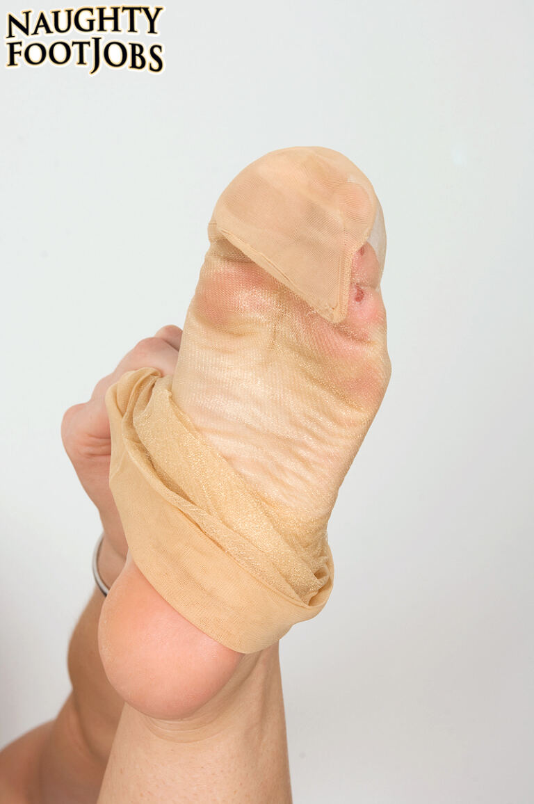 Krista Kaslo features in an adult footjob scene, with fishnet stockings and her toes kept in focus through the intimate partnered sequence. image 3