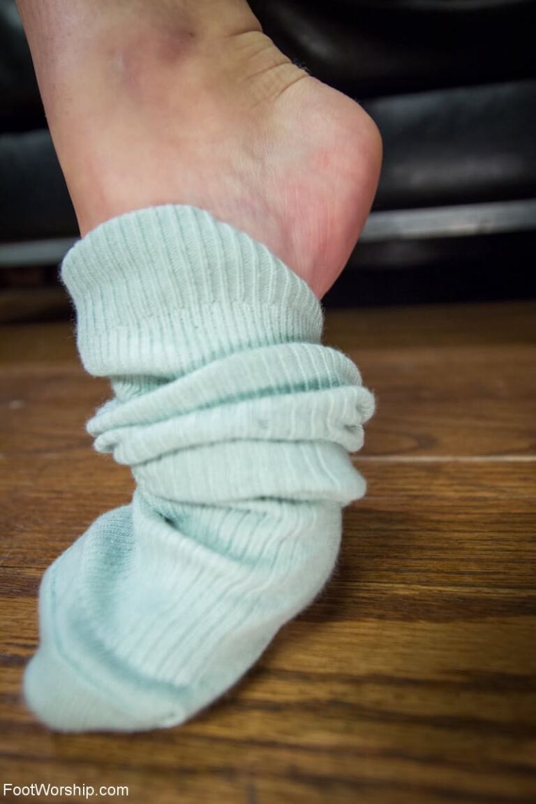 Serena Blair and Veronica Avluv remove shoes and hosiery in an adult foot-fetish set, with their bare feet kept in close focus. image 13